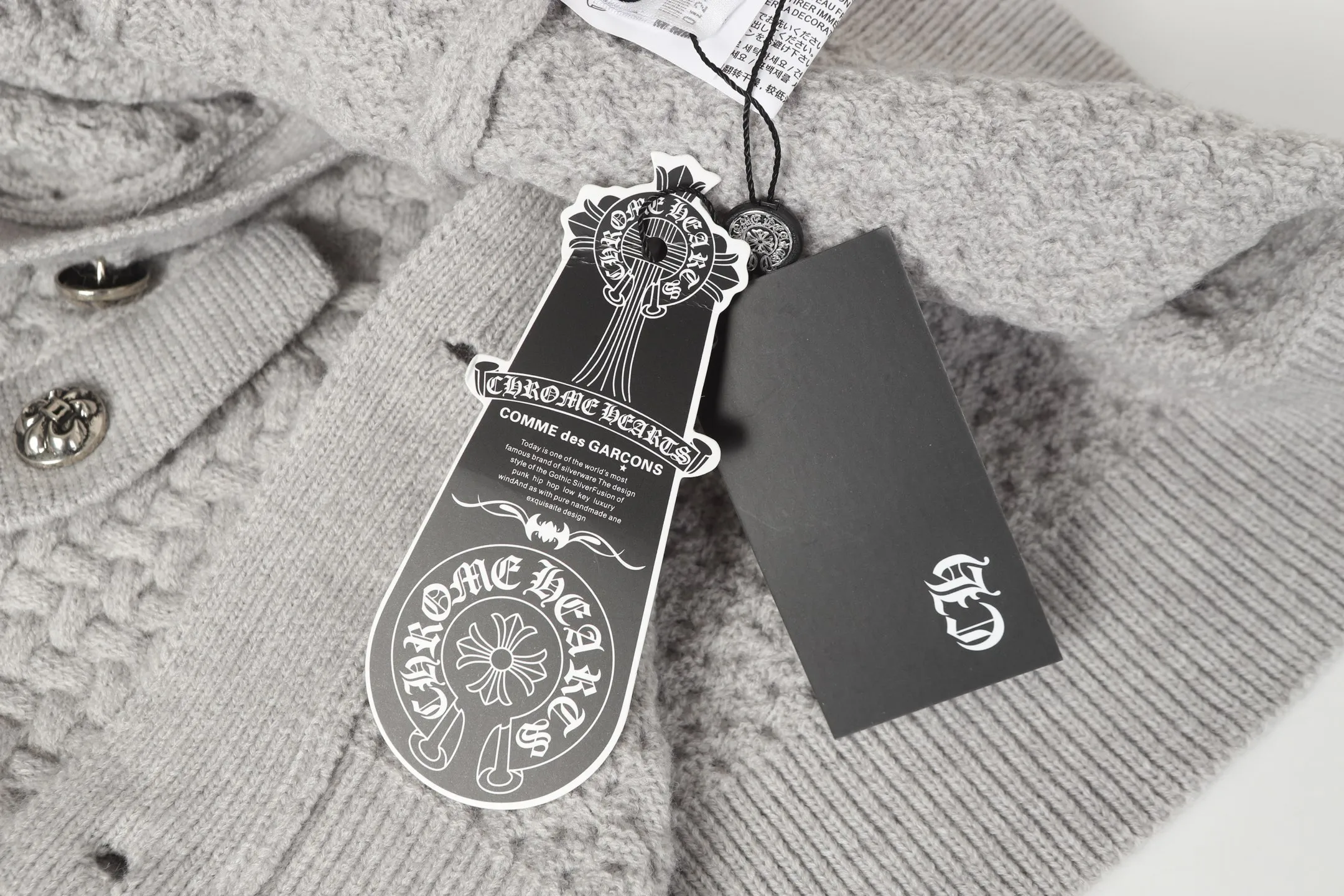 P300 #M904 - Chrome Hearts/Chrome Hearts Heavy Industry Sanskrit appliquéd embroidered cardigan knitted sweater - High weight, high density and high quality. The wool is soft, delicate and skin-friendly. It feels soft and silky. It has excellent warmth and skin-friendly properties. - Customized weaving and dyeing, no color difference. No matter the fabric or workmanship details, it is the ordinary version on the market. - Hardware zipper accessories are all customized, full of details -Colour: light gray black -Size: S M L XL